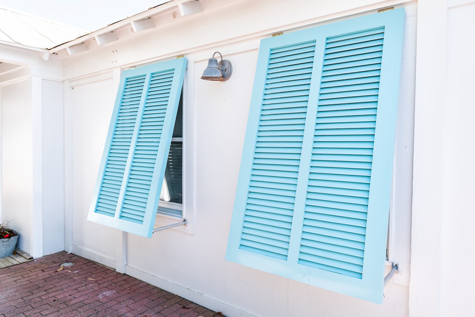 Blue Bahama shutters on home
